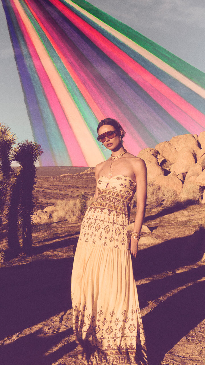 A model wearing a beige knit dress