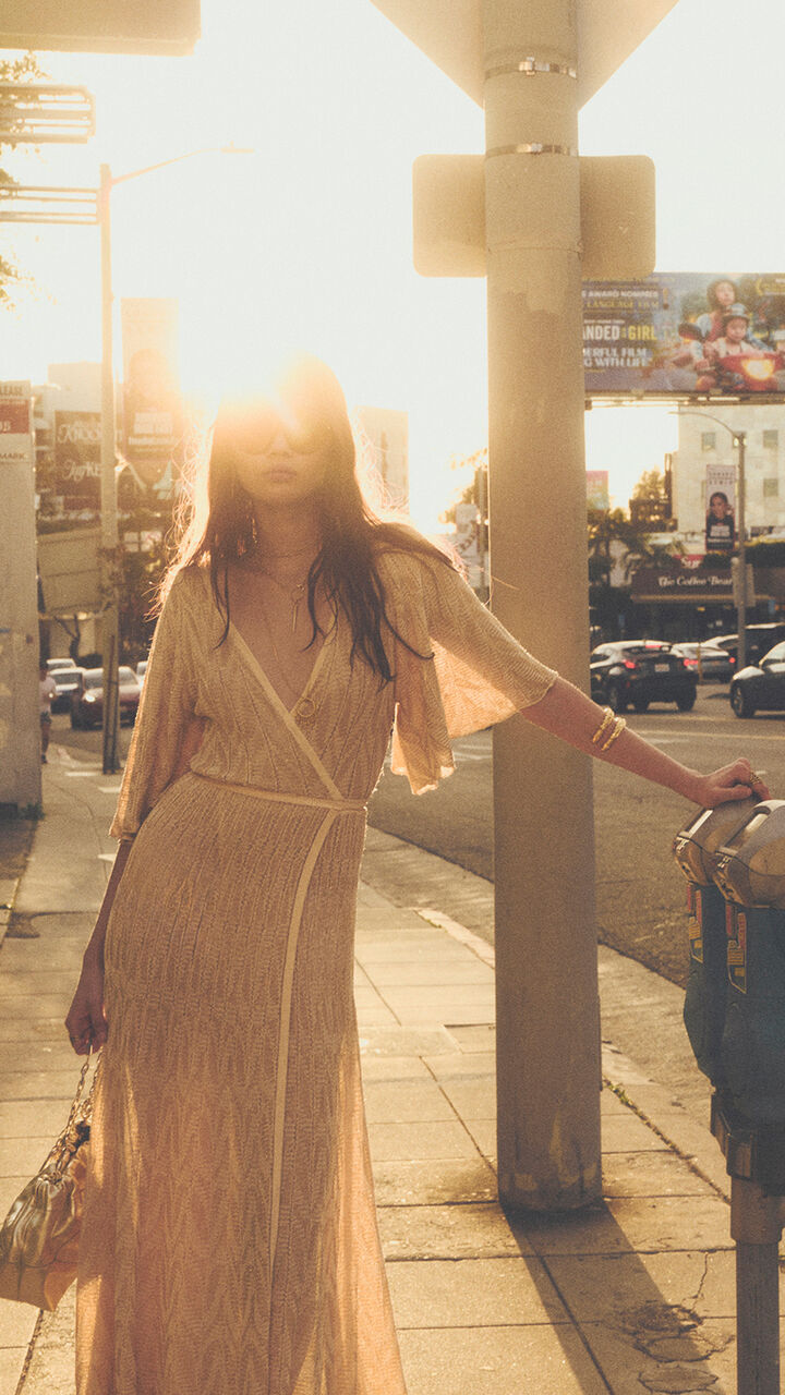 A model wearing a beige dress