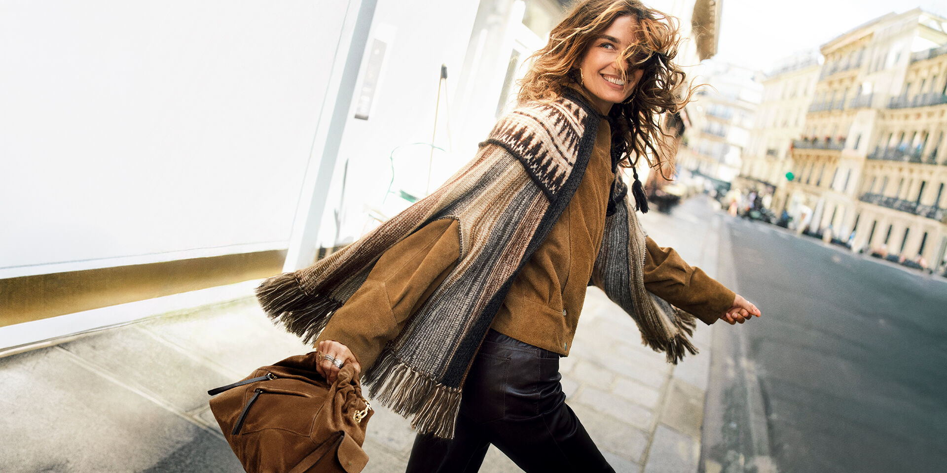 Abby Champion wearing a fur coat & a Youyou bag
