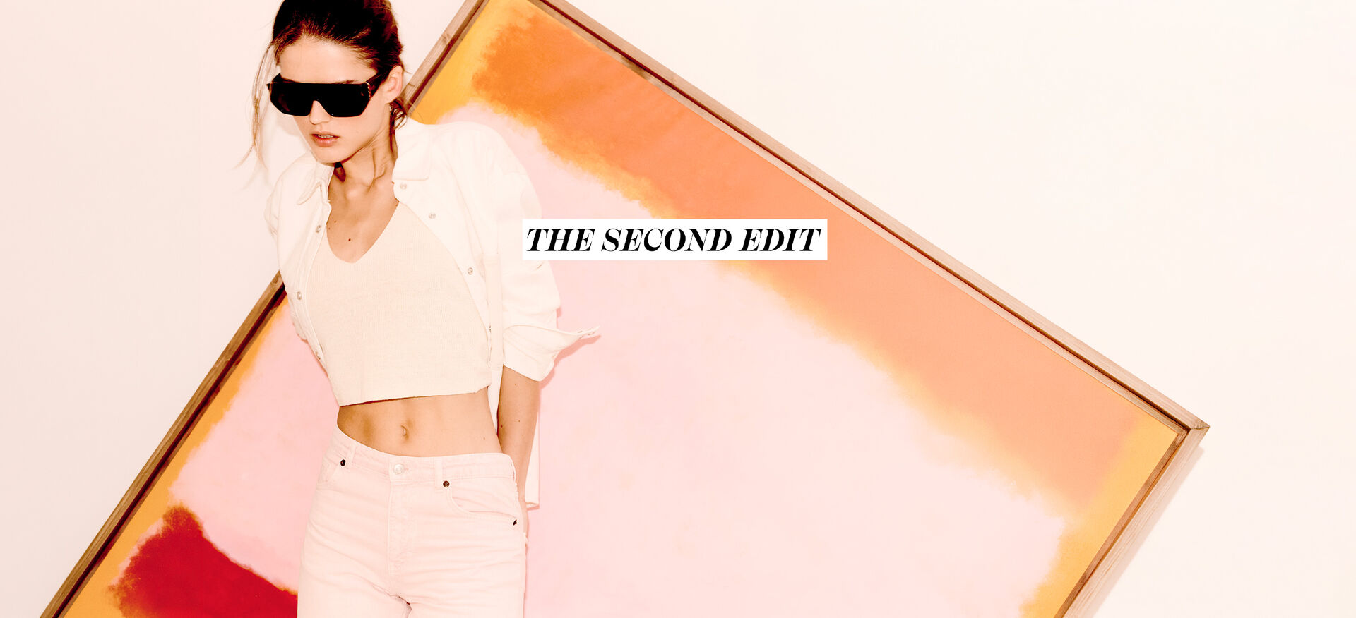 the second edit: a woman wearing a white outfit and sunglasses