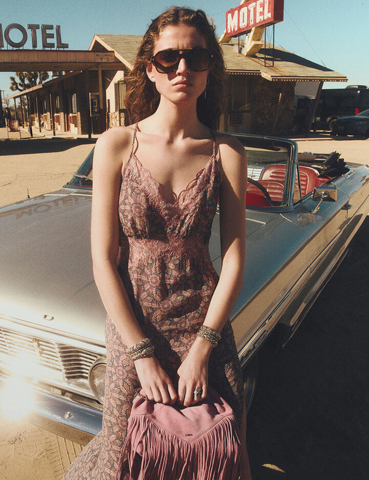 A model wearing a maxi dress