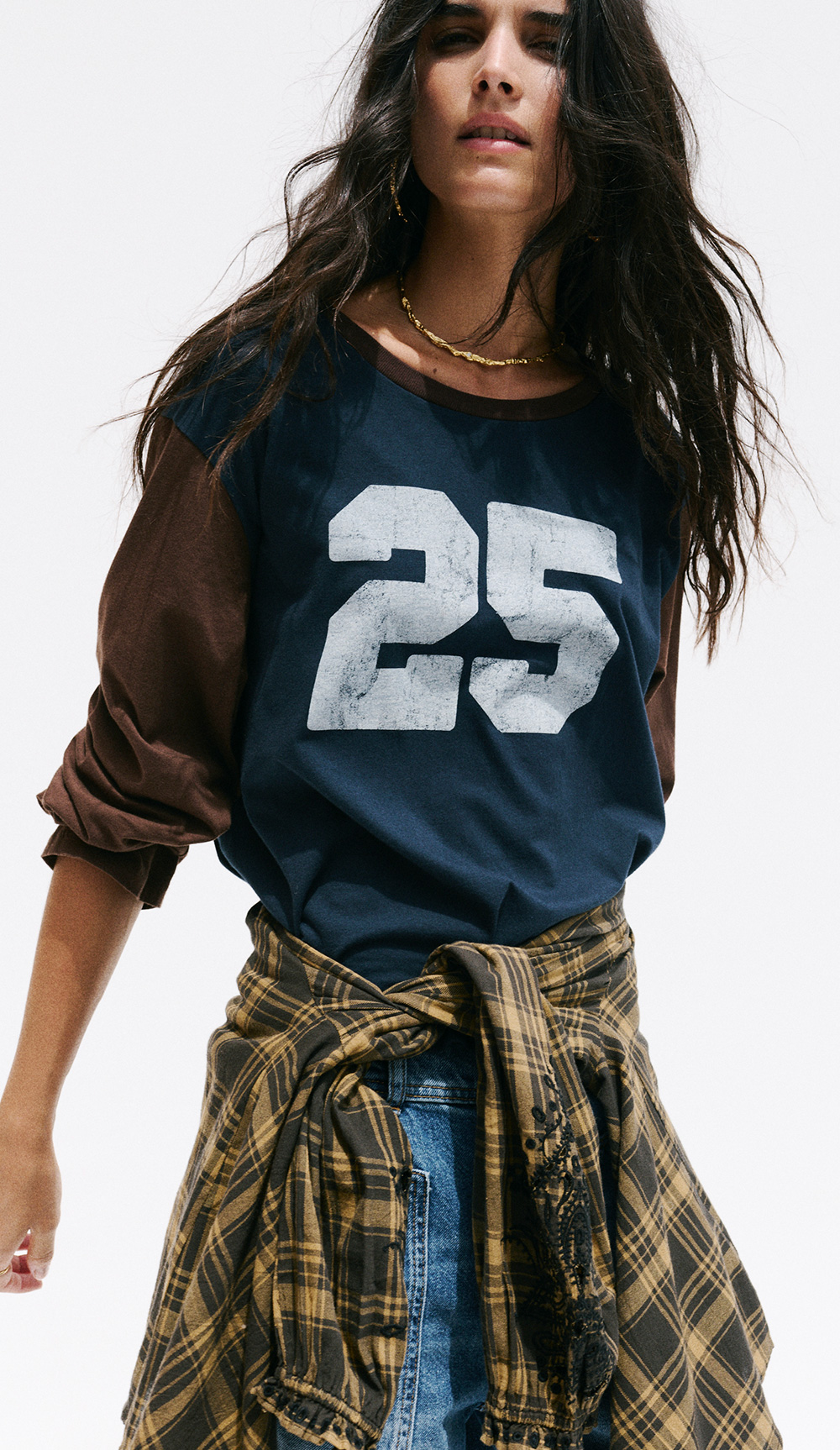 a model wearing a blue t-shirt