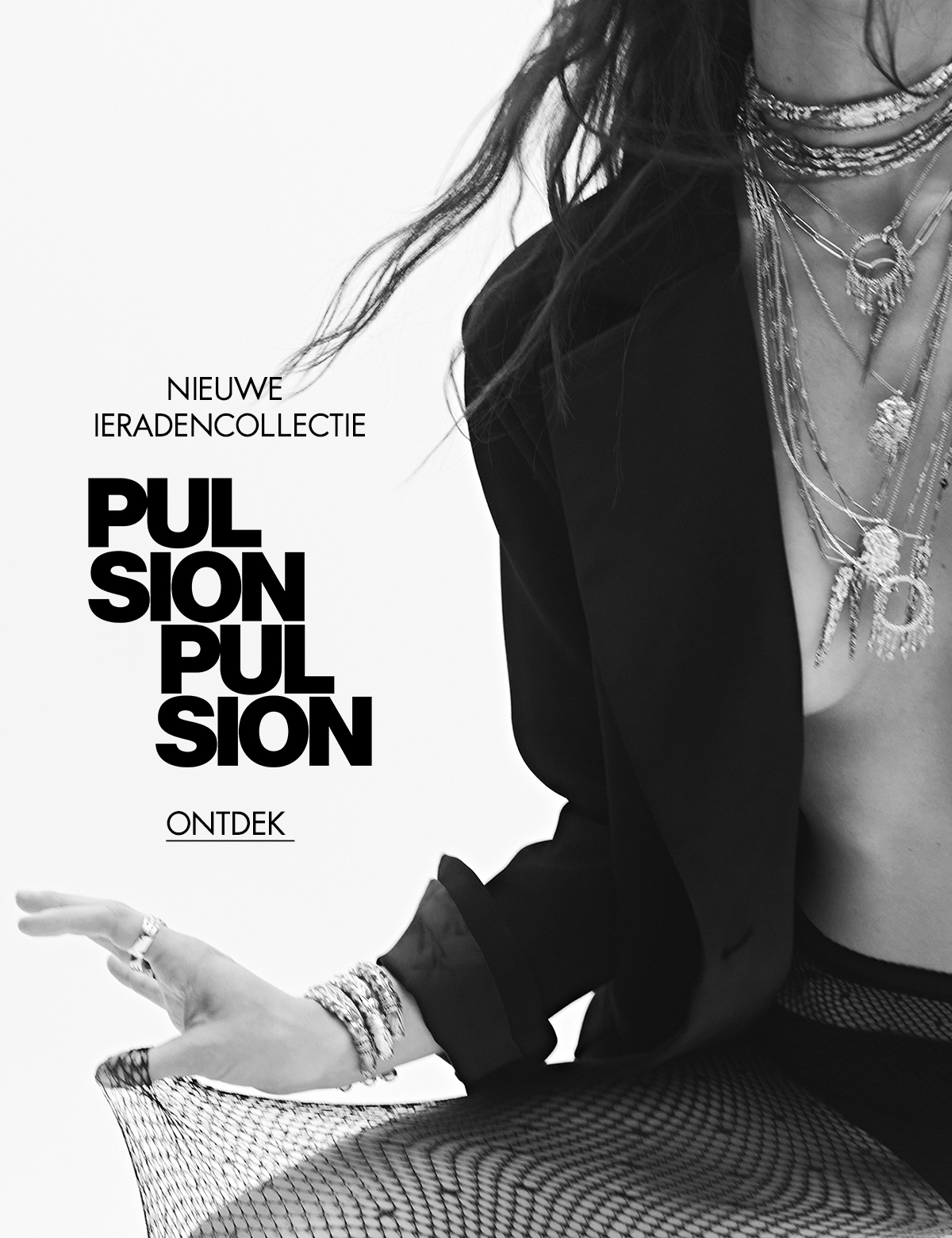 A model wearing ba&sh jewelry and a blazer, the photo is in black and white. 