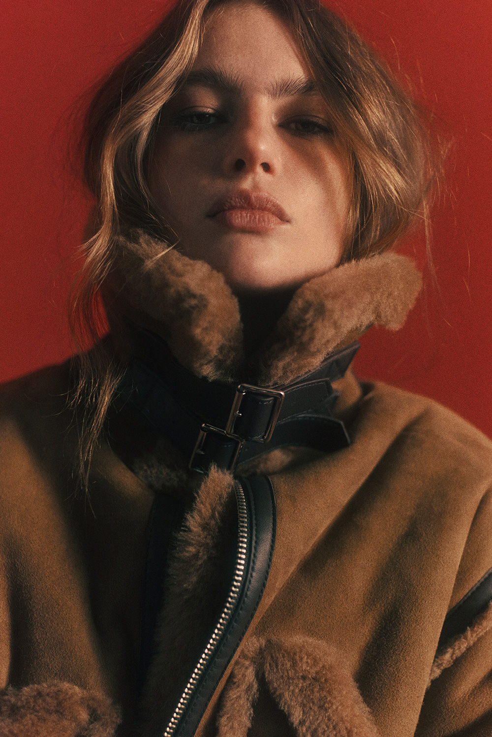 ba&sh gift guide - warm and cosy pieces to gift. Woman wearing an iconic ba&sh leather and suede jacket