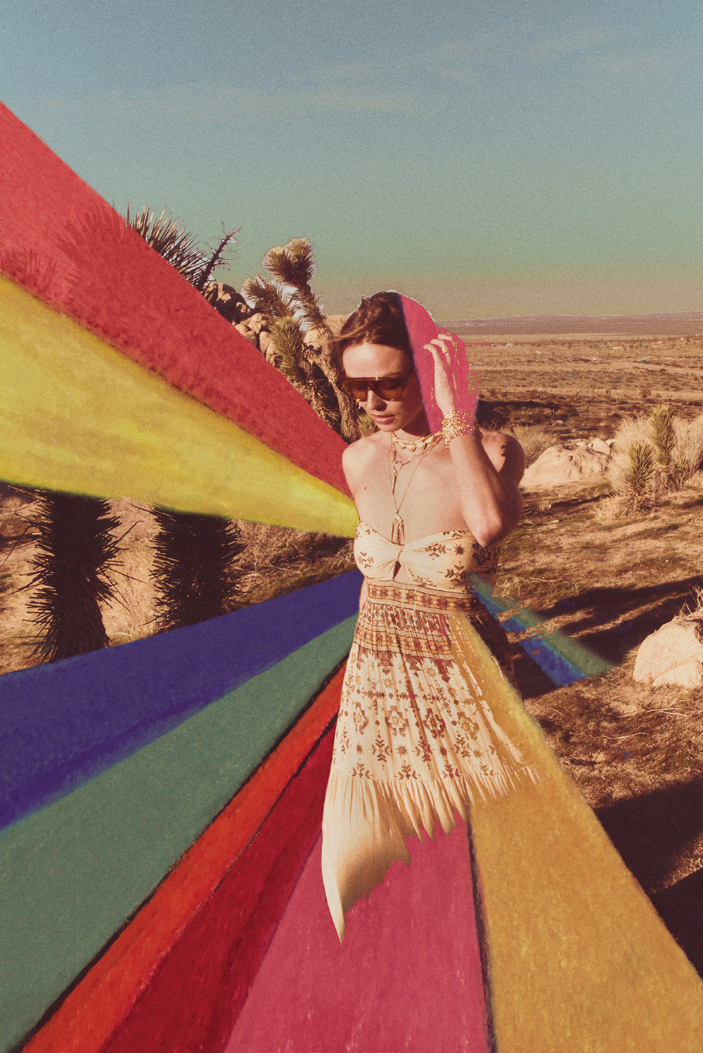 a woman in a printed dress with a rainbow