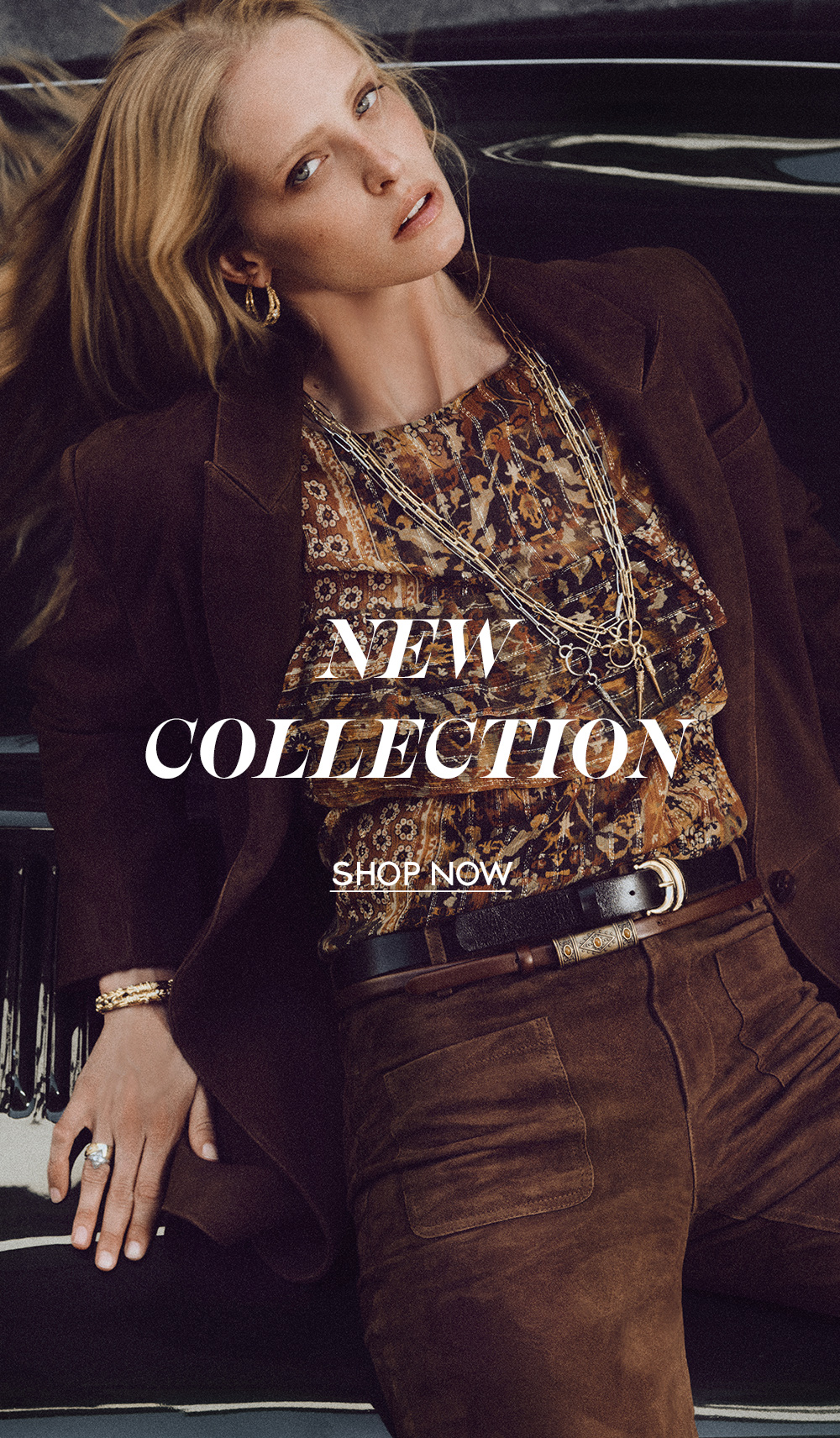 Abby Champion wearing a printed ba&sh blouse and a brown blazer