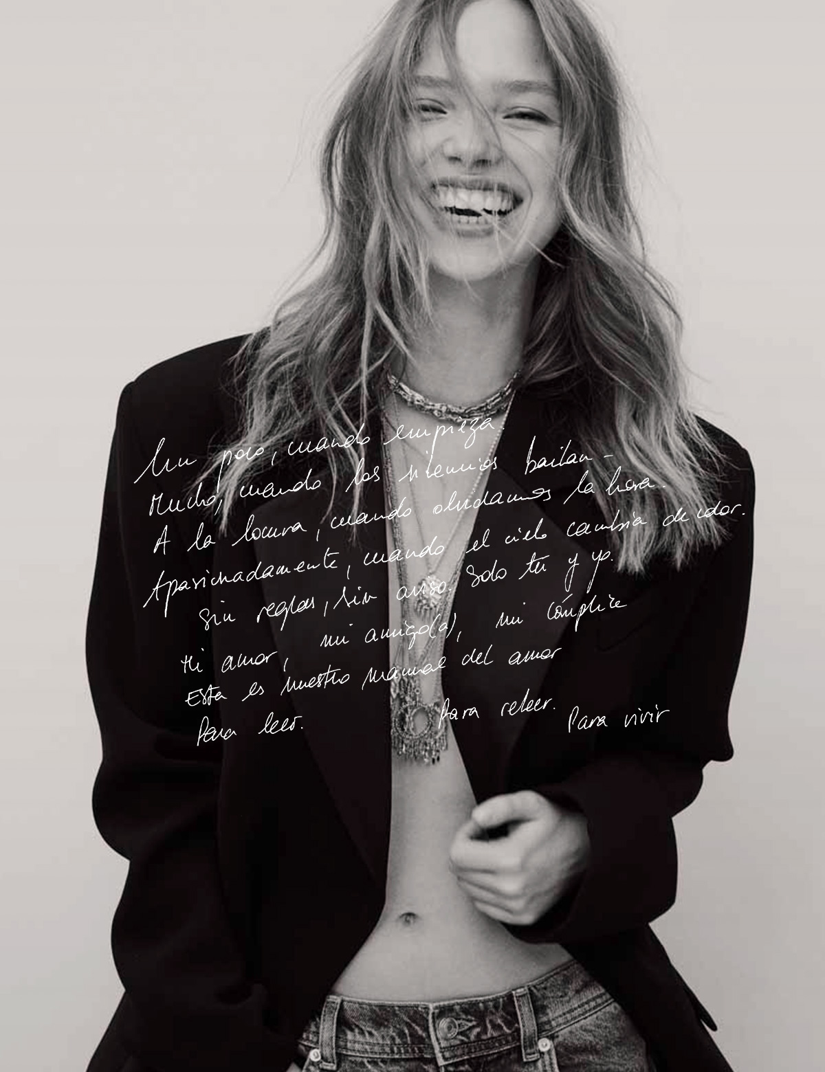 Blonde model wearing a black blazer and ba&sh necklaces