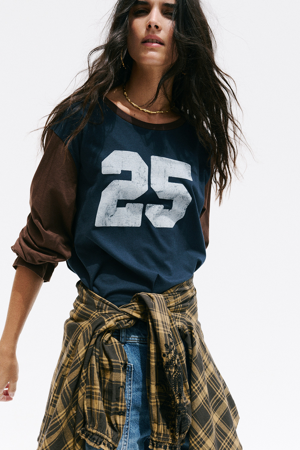 a model wearing a blue t-shirt