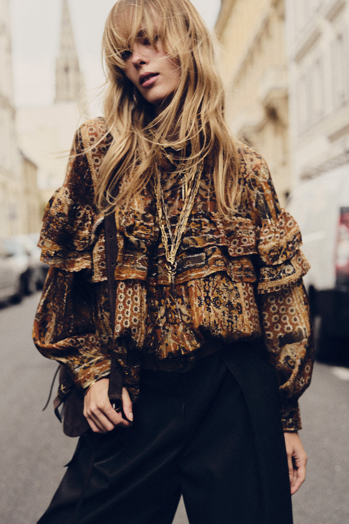 blond hair model with a printed blouse