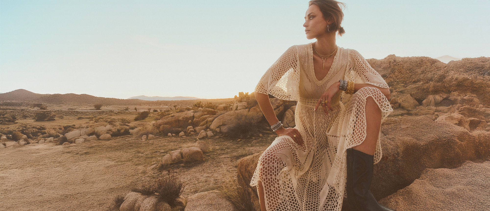 A model wearing a beige knit dress