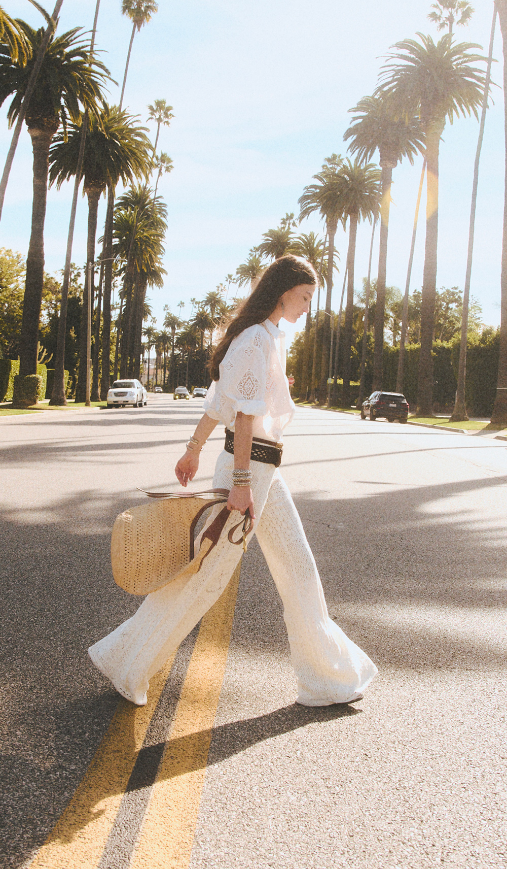 a model wearing a shirt and pants on the street 