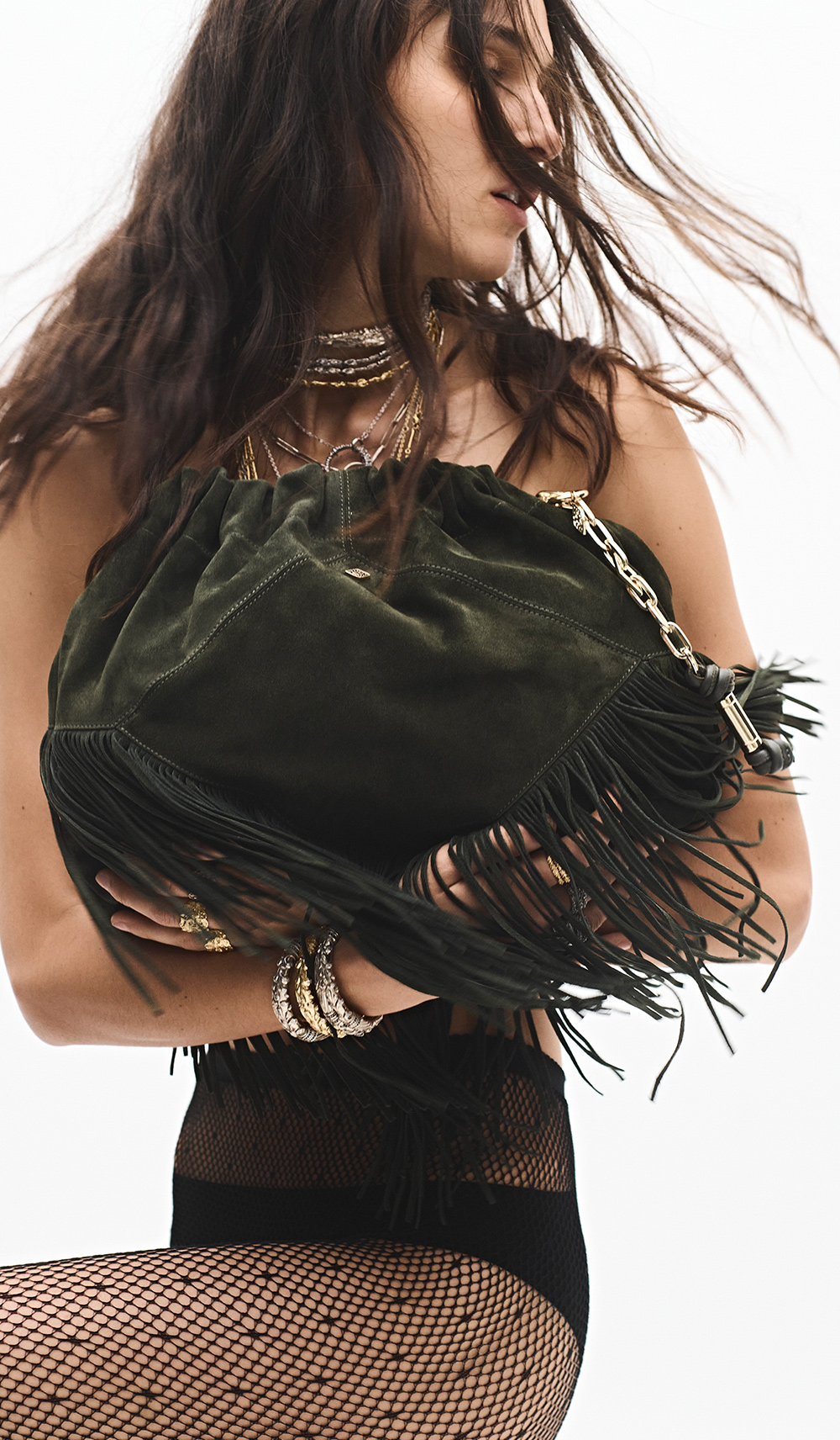 the model is wearing a June bag with fringing