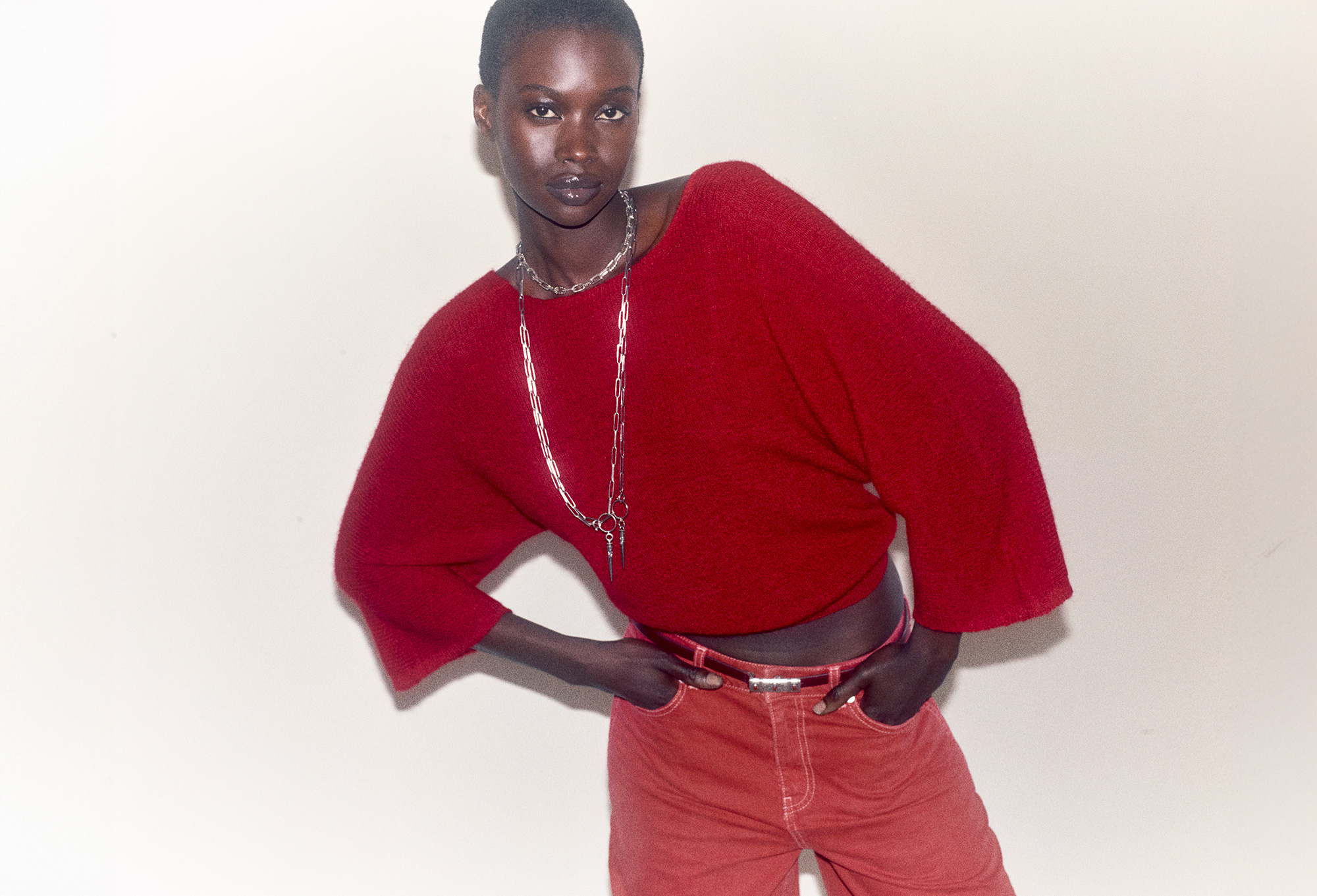 Model wearing a red jumper and red jeans. ba&sh red capsule