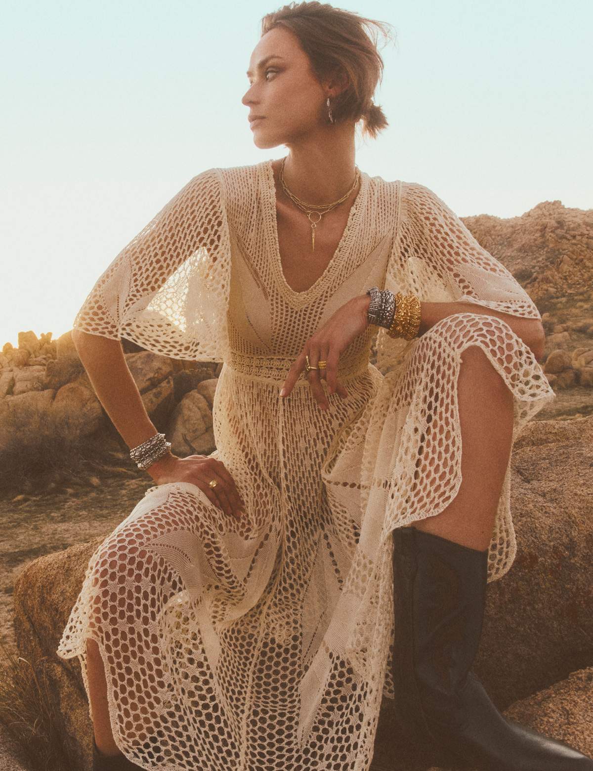 A model wearing a beige knit dress
