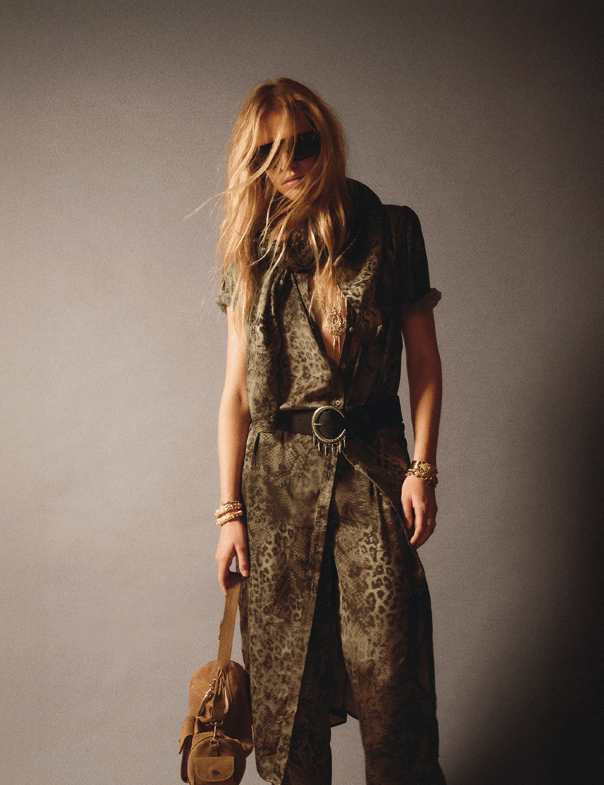 a model wearing a printed dress from the new collection 