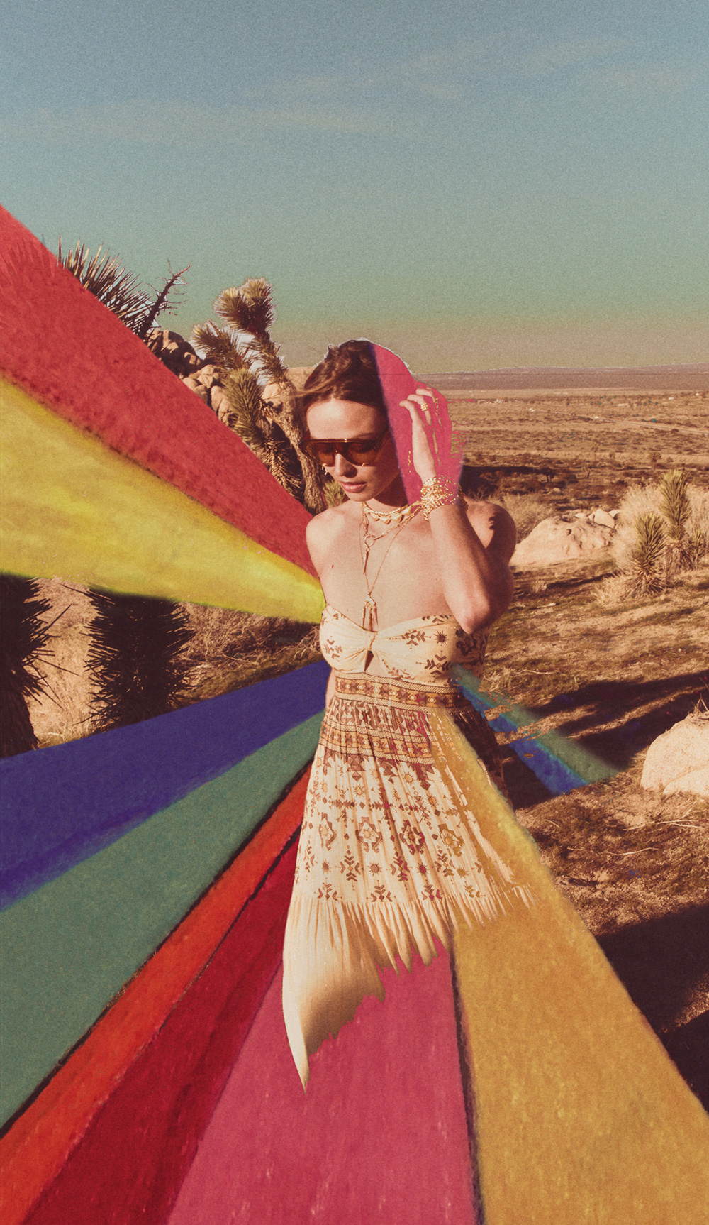 a woman in a printed dress with a rainbow