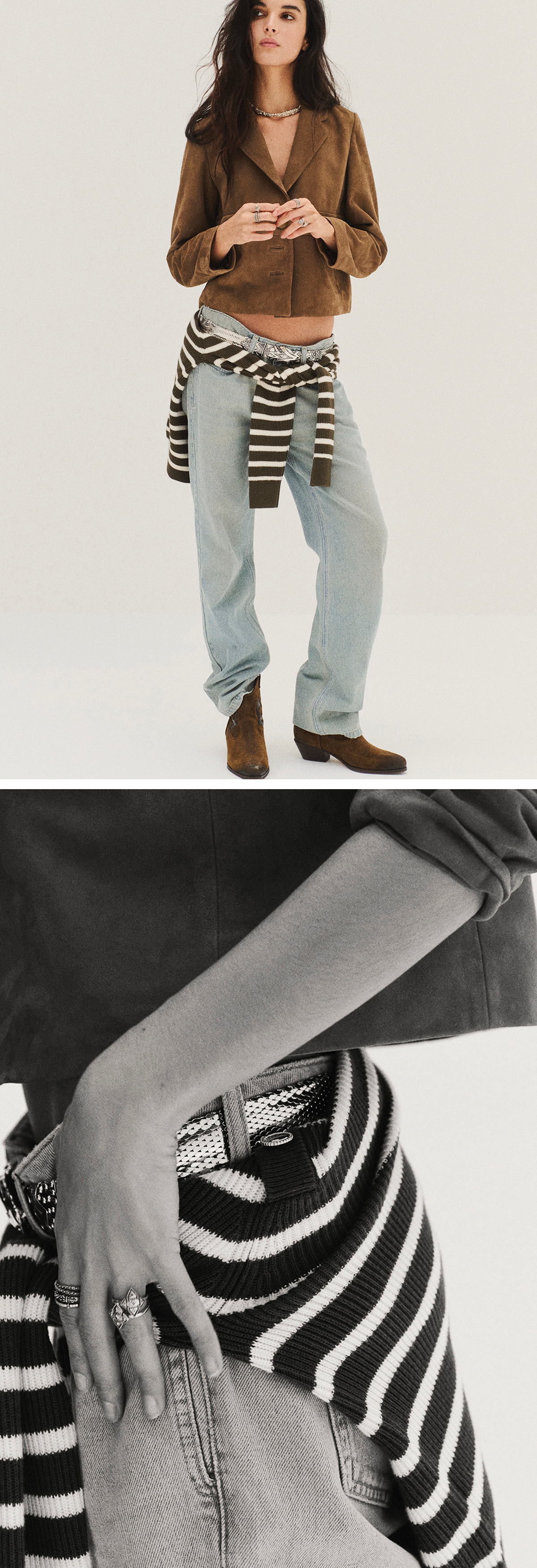 a model wearing light blue jeans, a suede jacket and a striped jumper