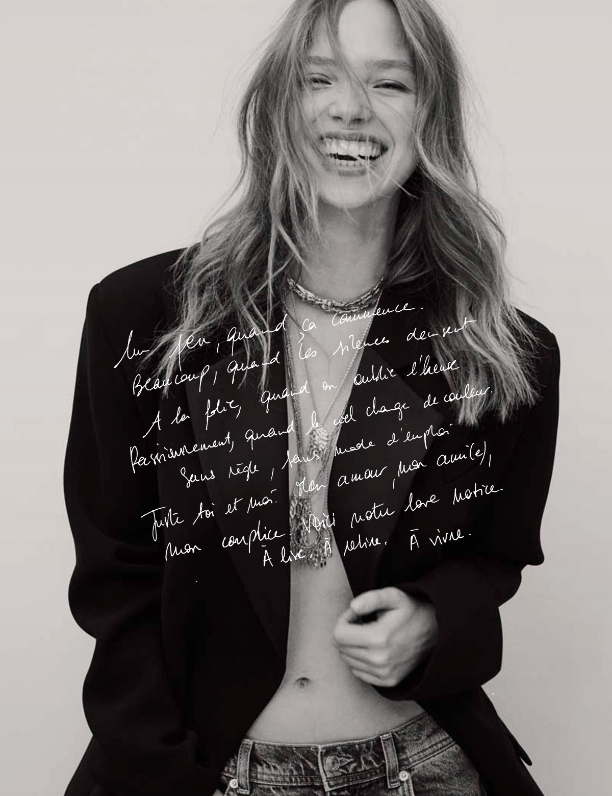 Blonde model wearing a black blazer and ba&sh necklaces