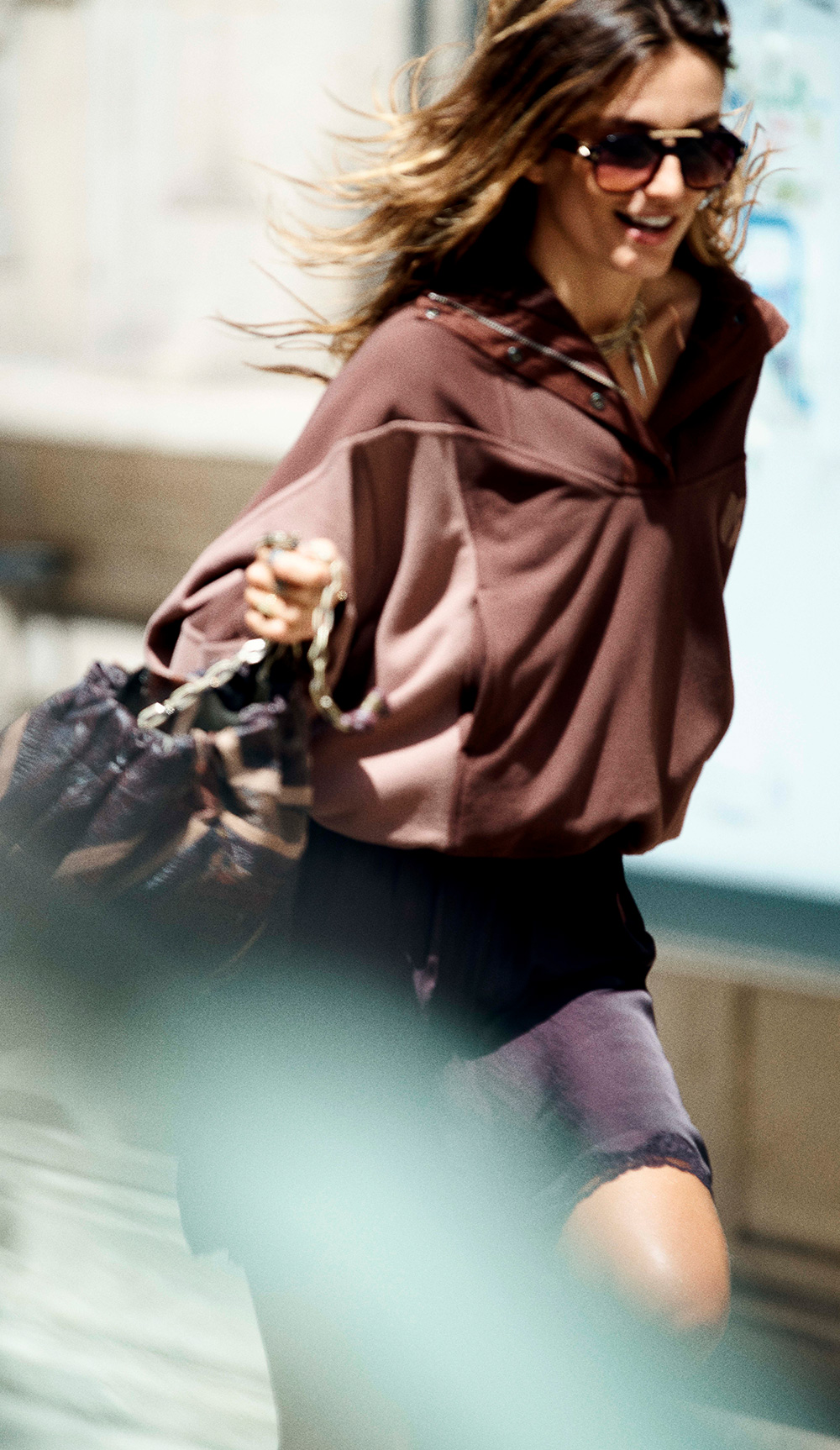 Andreea running in the street with bash sweatshirt