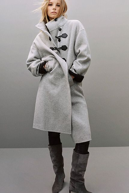 a model with a grey coat
