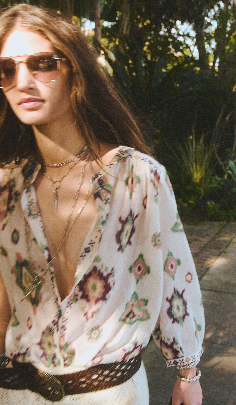 a model wearing a shirt and shorts on the street 