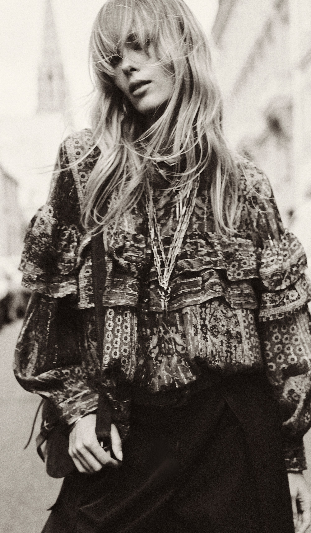 Blond hair model wearing printed shirt.