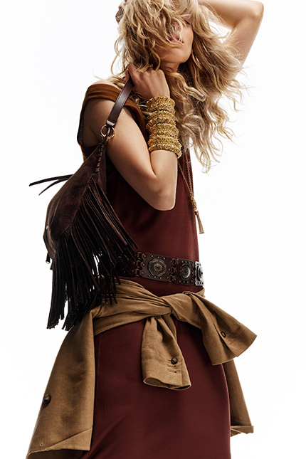 A model dancing with gold jewelry