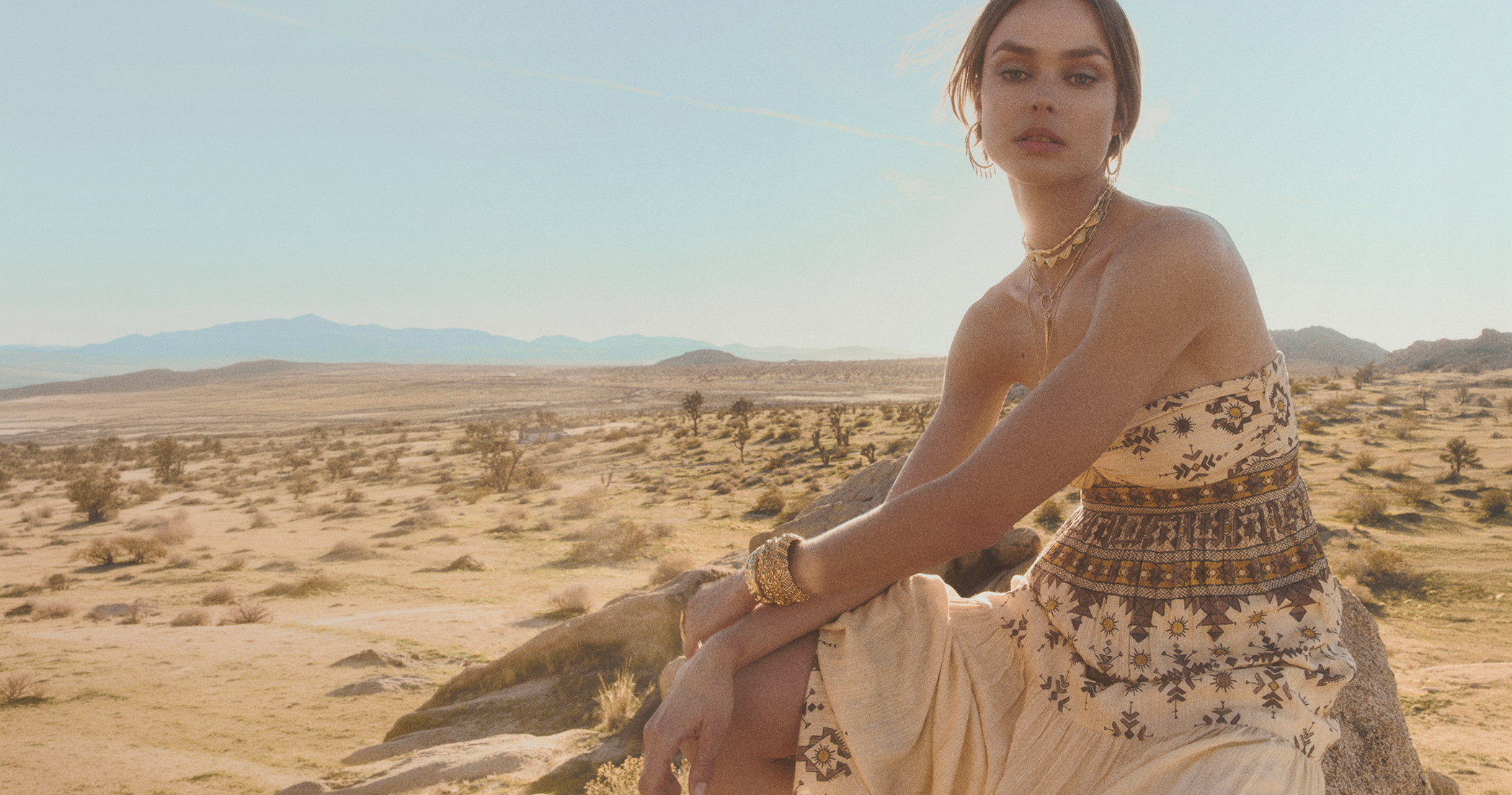A model wearing a beige knit dress