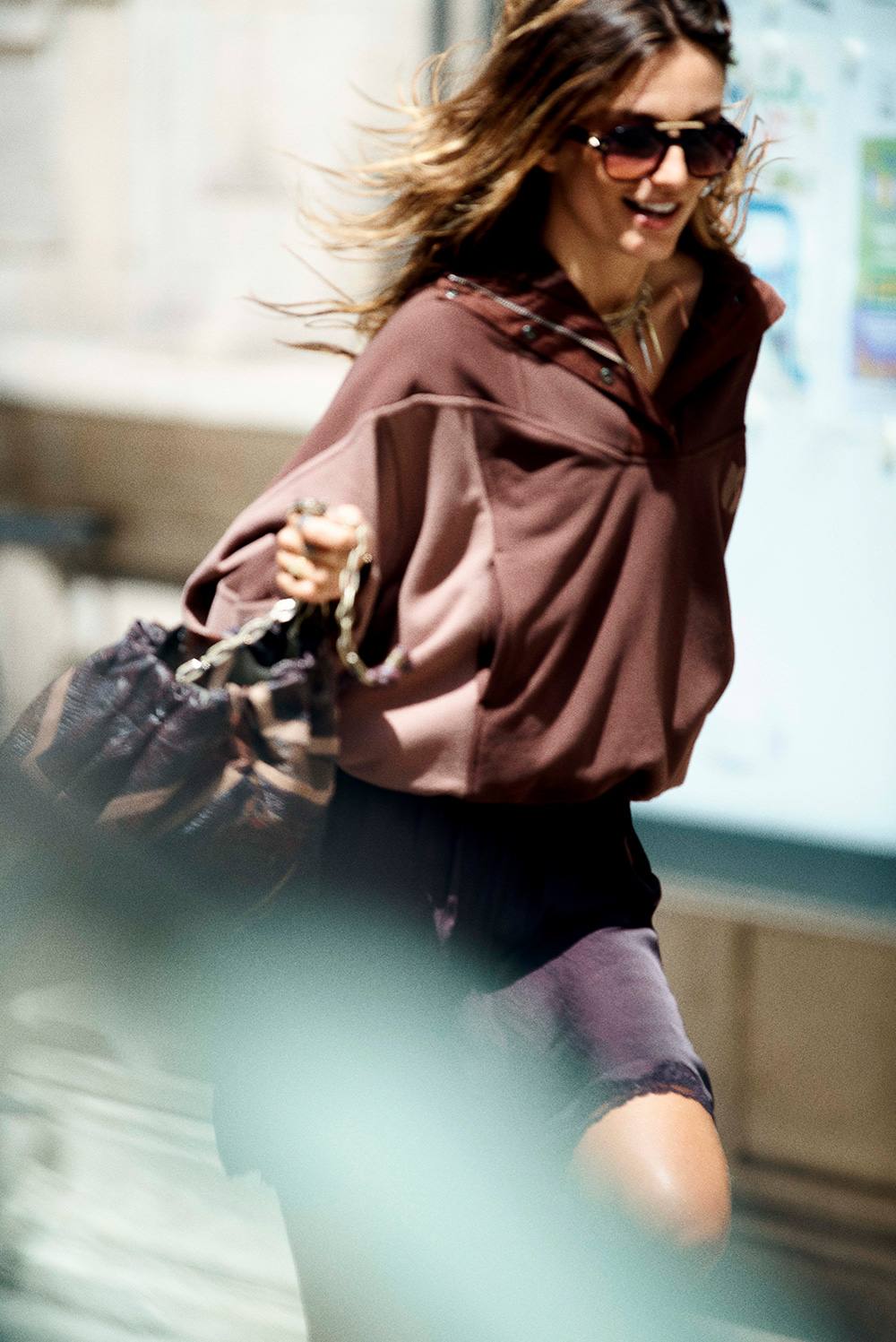 Andreea running in the street with bash sweatshirt