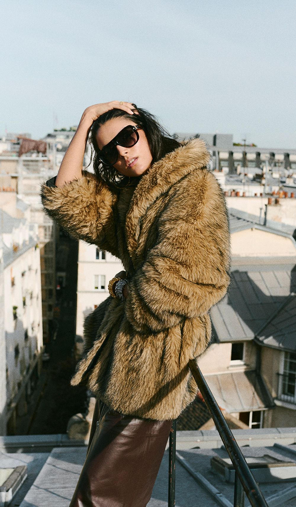 The model is wearing a faux fur coat 
