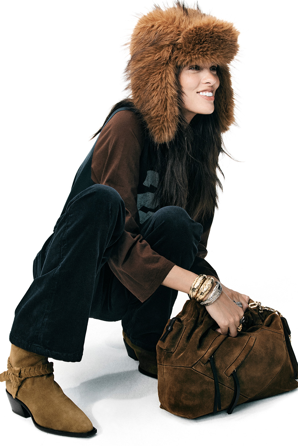The model is wearing the the June multi-pocket bag