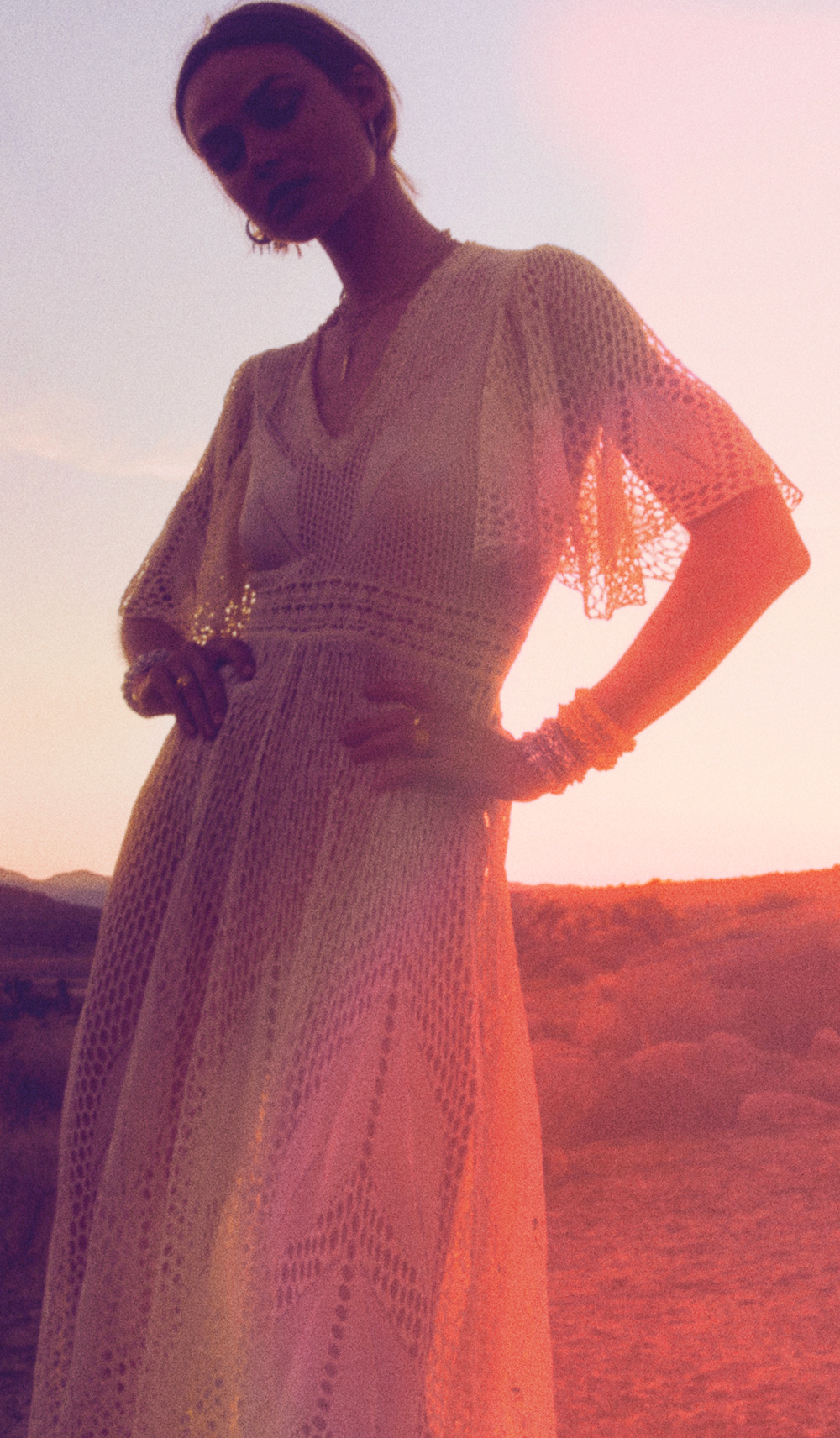a woman in a white knit dress 