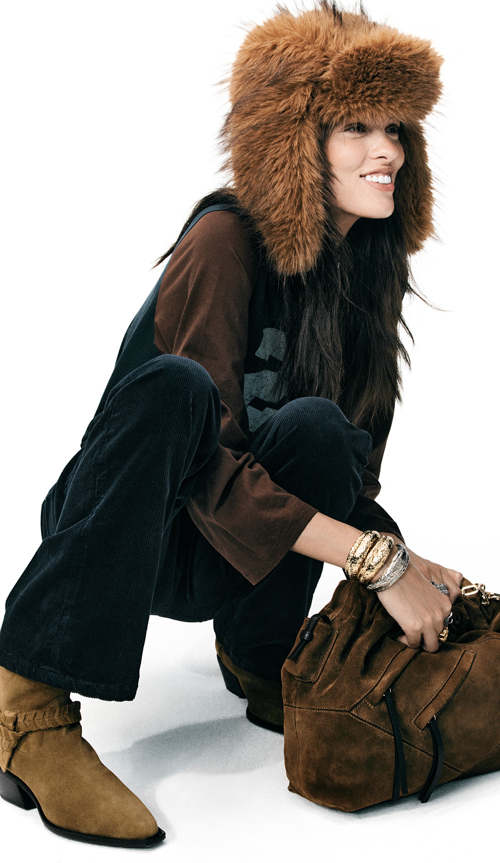 The model is wearing the the June multi-pocket bag