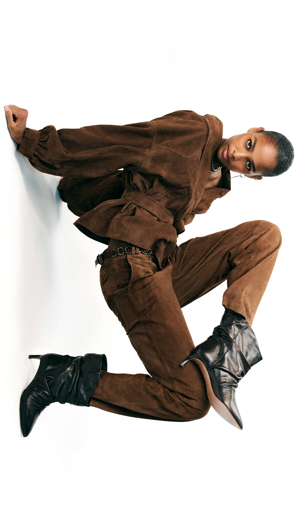 a model wearing a shirt and pants