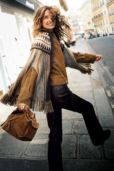 Abby Champion wearing a fur coat & a Youyou bag